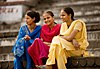 Ghat Gazing Photo: Three lovely Indian tourists sit by the ghats, taking in the hustle of daily life on the banks of the Ganges.  As illustrated in this photo, India is a feast for a photographer's senses.  Besides sight, a day in India brings chaotic stimulation to the rest of your senses.  This is a top reason India is one of my favorite countries in the world.  It, however, is not for everyone.
