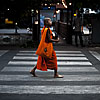 Middle Path Photo: A boy monk collects alms and offers blessings on the morning of the anniversary of Buddha's birth.