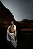 Priest & Cliffs Photo: A young Brahman poses for a strobed photo near the Badami archeological museum.  This boy Brahman was soon to perform pooja (prayers) for the festival of Shivaratri.