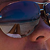 photo: Beauty & the Beach - Legs and sea reflected in a British girl's sunglasses.