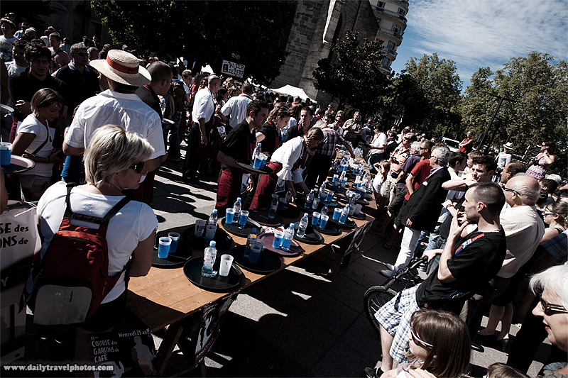 Finish line chaos and crowds at the Waiter's Run competition - Annecy, Haute-Savoie, France - Daily Travel Photos