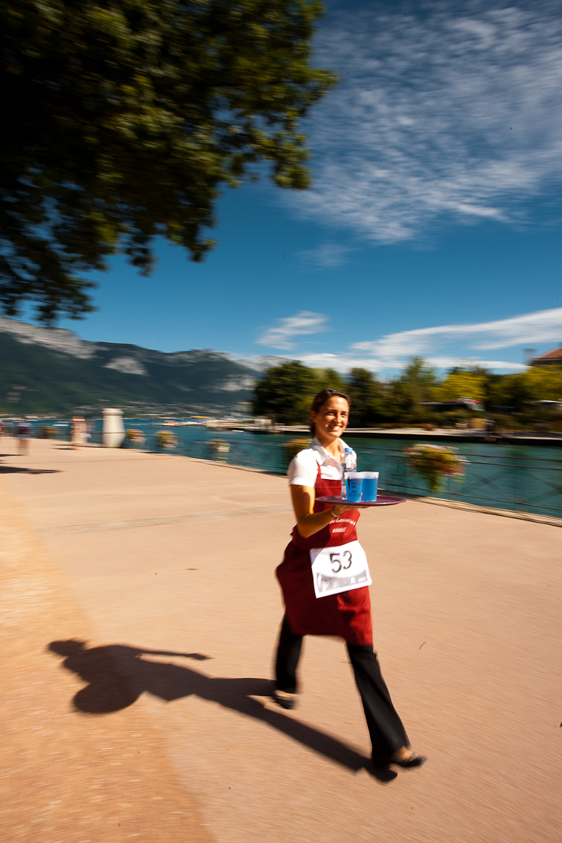Cute waitress hamming for the camera nearly drops her drinks at the Waiter's Run - Annecy, Haute-Savoie, France - Daily Travel Photos