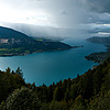 photo: Stormy Recreation - A paraglider braves storm clouds for a fly in the sky over Annecy Lake.