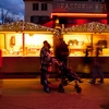 Chalets Shopping Photo: Tourists enjoy a chalet cheese shop at a Christmas market in old Annecy at dusk.